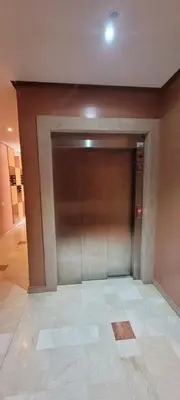 a large metal garage door in a building at Apartment Close to Casablanca Mohamed V Airport in Nouaseur
