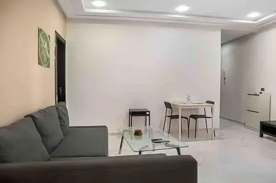 a living room with a couch and a table at Gauthier studio in Casablanca