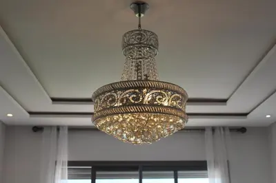 a large chandelier hanging from a ceiling at Apparentement des jardins paisibles in Mohammedia