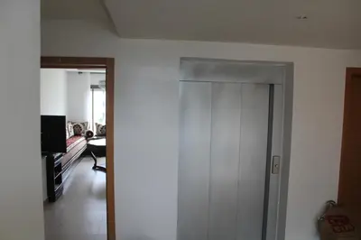a hallway with a white door in a room at Appartement du bonheur Paradise in Mohammedia