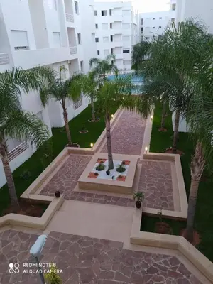 an aerial view of a courtyard with palm trees at BOUZNIKA T1 in Bouznika
