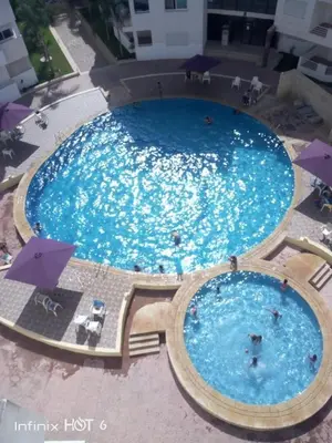 an overhead view of a large swimming pool at Le Petit Havre de Joie BOUZNIKA in Bouznika