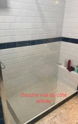 a shower with a sign that says doozy we are in golf entrance at Appartement RIM in Casablanca