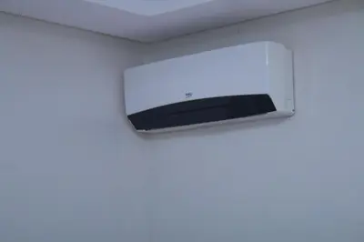 a television hanging on a wall in a room at Le paradis du pêcheur BOUZNIKA in Bouznika