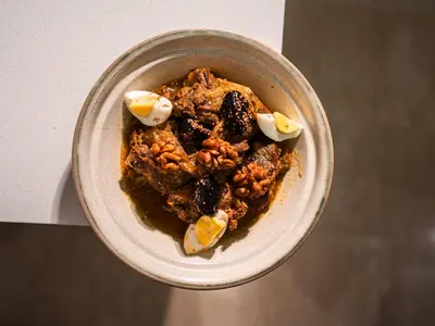a bowl of food with nuts and eggs on a table at Hotel Al Walid in Casablanca