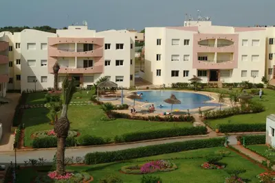 an aerial view of a resort with a swimming pool at MOHAMMEDIA Appartement avec 3 piscines et prés de plage in Mohammedia