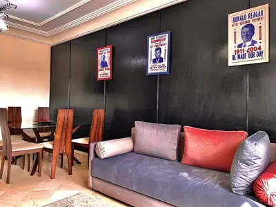 a living room with a couch and a table at Sab 8 - Amazing view. 2 bedrooms in front of the mosque Hassan. Perfect location in Casablanca