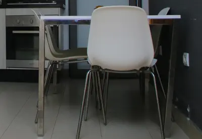 two chairs sitting at a table in a kitchen at MOHAMMEDIA Paradise Beach in Mohammedia