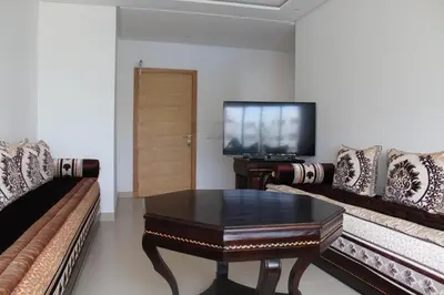 a living room with a couch and a coffee table at Paradise BEACH in Mohammedia