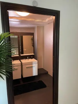 a bathroom with a sink and a mirror at Skhirat VILLA Zhor in Skhirat