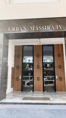 a building with the entrance to an american museum ofysics at Massira Diamond Maarif- Parking-wifi-self check in in Casablanca