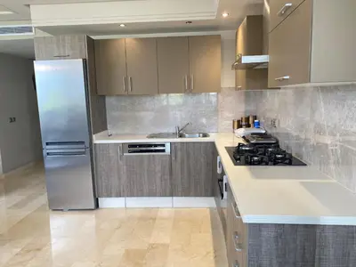 a kitchen with a refrigerator and a stove top oven at #26 Maarif urban Massira near twin center casablanca in Casablanca
