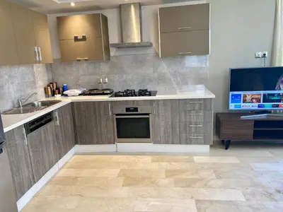 a kitchen with a sink and a stove top oven at #26 Maarif urban Massira near twin center casablanca in Casablanca