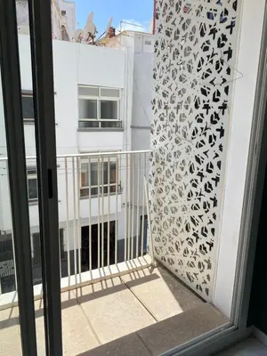 a view from the balcony of a building with a window at GREEN HOUSE OVERLOOKING INTERNATIONAL SCHOOL in Casablanca