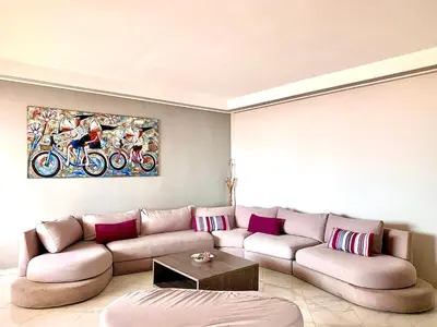 a living room with a couch and a table at Anfa 118 - Best view in town - 3 bedrooms - 2 Bathrooms in Casablanca