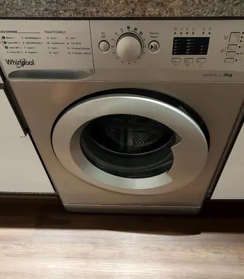 a silver washing machine sitting on top of a counter at luxury apartment opposite HASSAN 2 MOSQU and FAIR international casablanca and SEA , near downtwn , INTERDIT COUPLES ARAABIC NON MARIÈ, FORBIDDEN UNMARRIED ARAABIC COUPLES , 2 room, 2 living rooms and 2 bathrooms basement car park FREE , apartment with in Casablanca