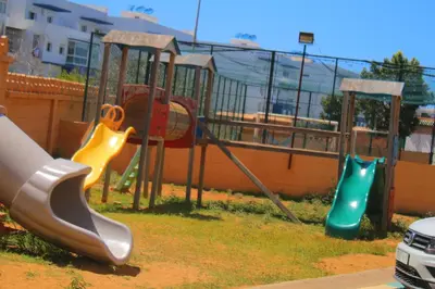 a playground with three slides and a slide at MOHAMMEDIA Residence KAWTAR in Mohammedia