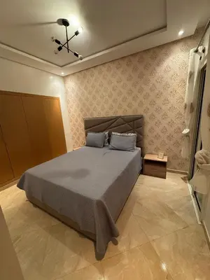 a bedroom with a bed in a room at CASA BAY BEACH OMK in Sidi Rahal