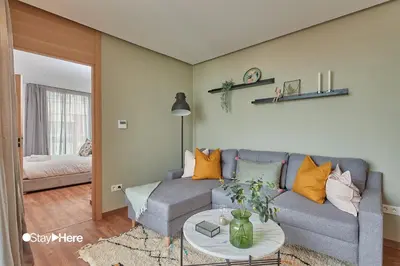 a living room with a couch and a table at Stayhere Casablanca - Palmier - Executive Residence in Casablanca