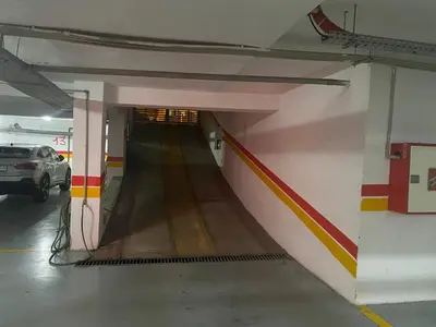 a tunnel in a parking garage with a car in it at #10 Racine triangle d or near aindiab in Casablanca