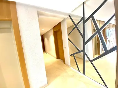 a hallway with a metal screen in a house at Anfa Living 11 - Classy & Élégant near the Sea in Casablanca