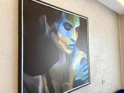 a large painting of a man on a wall at Anfa Living 11 - Classy & Élégant near the Sea in Casablanca