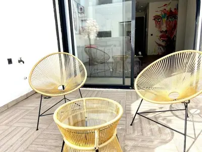 three wicker chairs sitting in front of a store at Metropolitan 19- 2 BEDROOMS with terrace NEW&SUNNY in Casablanca