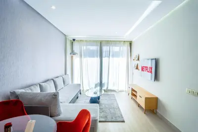 a living room with a couch and a table at #13 Fresh Appart in new residence in Casablanca
