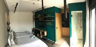 a bedroom with a bed and a green wall at RABAT Residence - OCEAN STAY in Rabat