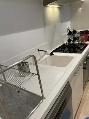 a kitchen with a stove and a white counter top at Appartement Anfa Park casa finance City CFC in Casablanca