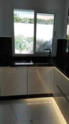 a kitchen with a sink and a window at Villa avec piscine privée près de Casablanca Maroc in Dar Bouazza