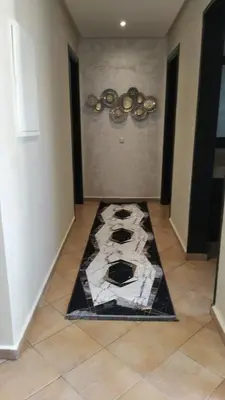 a room with a rug on the floor at Villa avec piscine privée près de Casablanca Maroc in Dar Bouazza