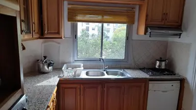 a kitchen with a sink and a window at Adarissa House in Rabat
