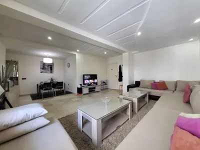 a living room with a couch and a table at Luxury Spacious Apartment Midtown Casablanca in Casablanca