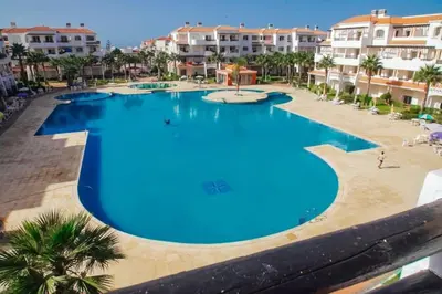 an overhead view of a large swimming pool in a resort at Sidi Rahal , Residence Garden Beach 2 in Sidi Rahal
