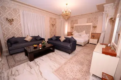a living room with a couch and a table at THE WHITE PALACE Rabat in Rabat