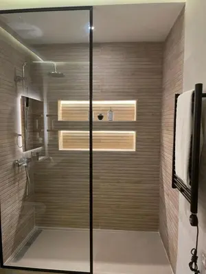 a shower with a glass door in a bathroom at Anfa Place, Art Deco Luxury Apartment, Sunny Ocean View in Casablanca