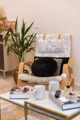 a living room with a chair and a coffee table at Airport Apartment Suite Casablanca FREE WIFI Modern Confort Calme in Derroua