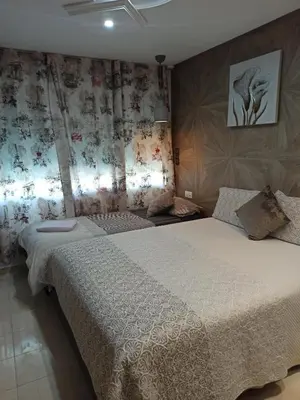 a bedroom with a large bed in a room at Aryam Room in Rabat