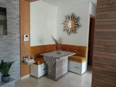 a bathroom with a table and a mirror on the wall at Aryam Room in Rabat