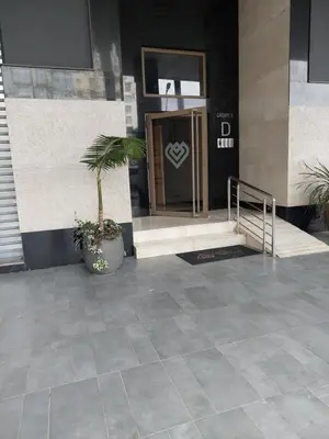 a front door of a building with a potted plant at Central Park House - 70m² in Mohammedia