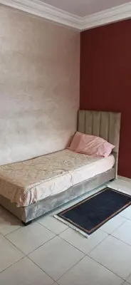 a small bed in a room with at La Perle in Casablanca