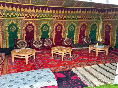 a room with couches and tables on a rug at American Farm Villa Grand Casablanca/El Jadida in Zaouia Sidi Bou Azza