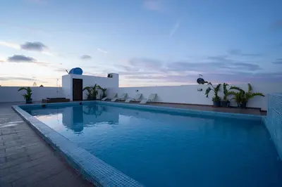 a swimming pool on the roof of a building at La cascade de Maryline in Casablanca