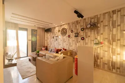 a living room with a couch and a table at Le Vintage Dead Sea in Casablanca
