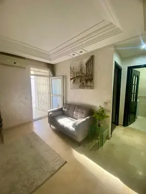 a living room with a couch and a table at Appartement de lux in Casablanca