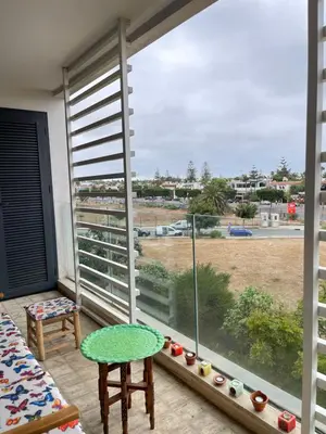 a room with a large window with a view of a field at Luxury Flat in Casa Finance City in Casablanca