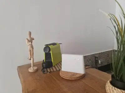 a table with a figurine and a computer on it at appartement de luxe front mer à DAR BOUAAZA in Dar Bouazza