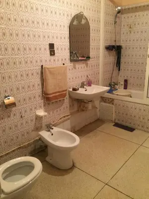 a bathroom with a toilet and a sink at Property located in a quiet area close to the train station and town in Casablanca