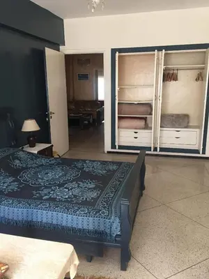 a bedroom with a bed and two bunk beds at Property located in a quiet area close to the train station and town in Casablanca